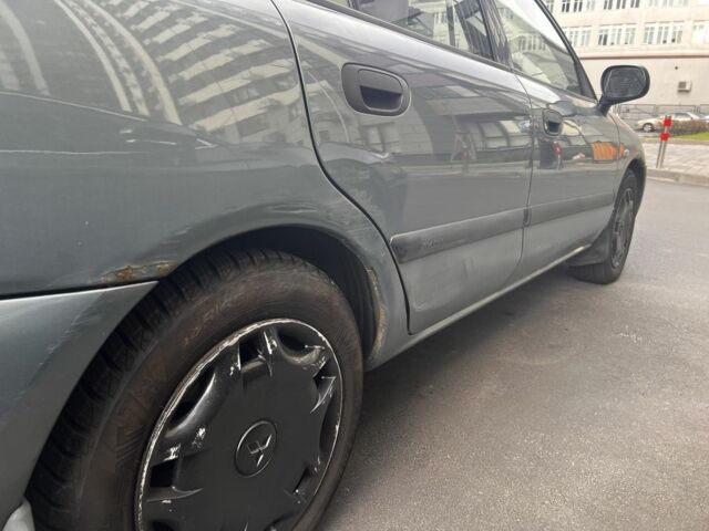 Зеленый Мицубиси Харизма, объемом двигателя 1.6 л и пробегом 211 тыс. км за 3200 $, фото 6 на Automoto.ua