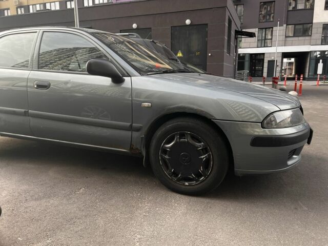 Зеленый Мицубиси Харизма, объемом двигателя 1.6 л и пробегом 211 тыс. км за 3200 $, фото 7 на Automoto.ua