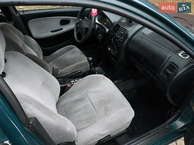 Зеленый Мицубиси Харизма, объемом двигателя 1.6 л и пробегом 357 тыс. км за 1480 $, фото 16 на Automoto.ua