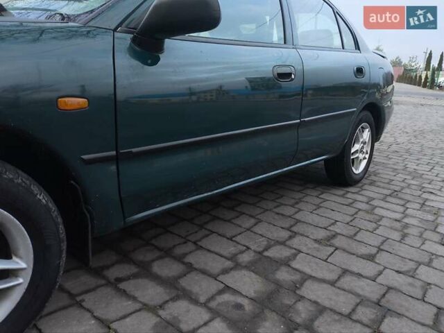 Зелений Міцубісі Харизма, об'ємом двигуна 1.6 л та пробігом 357 тис. км за 1399 $, фото 6 на Automoto.ua