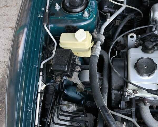 Зелений Міцубісі Харизма, об'ємом двигуна 1.6 л та пробігом 357 тис. км за 1499 $, фото 23 на Automoto.ua