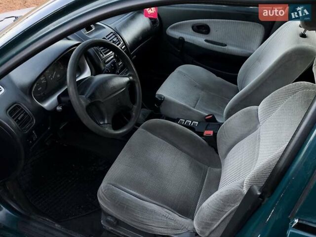 Зелений Міцубісі Харизма, об'ємом двигуна 1.6 л та пробігом 357 тис. км за 1499 $, фото 7 на Automoto.ua