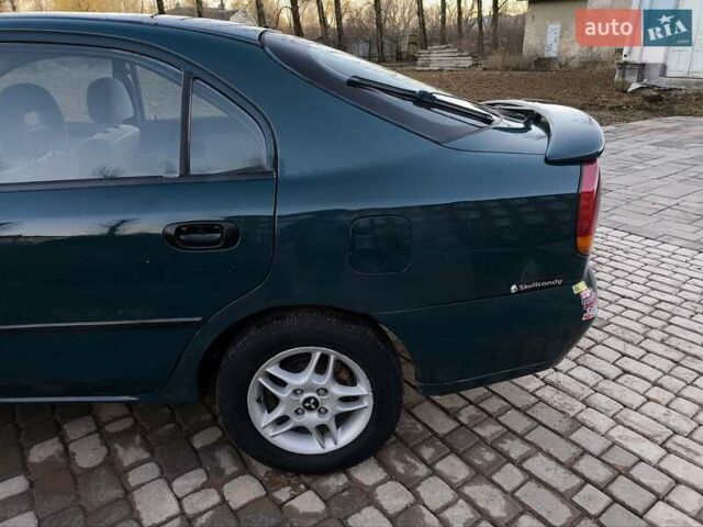 Зелений Міцубісі Харизма, об'ємом двигуна 1.6 л та пробігом 357 тис. км за 1499 $, фото 10 на Automoto.ua