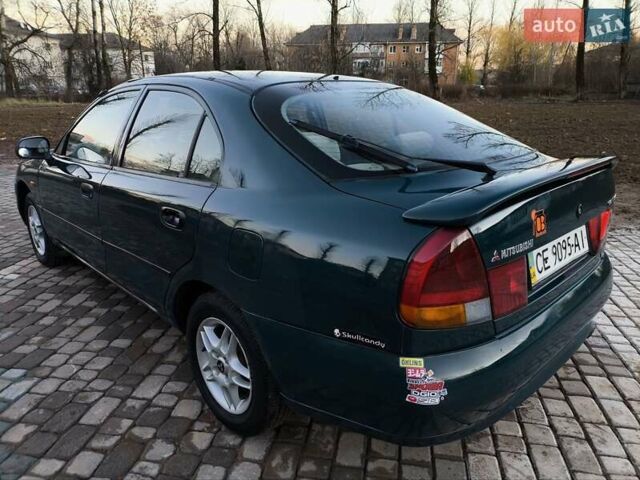 Зелений Міцубісі Харизма, об'ємом двигуна 1.6 л та пробігом 357 тис. км за 1499 $, фото 3 на Automoto.ua