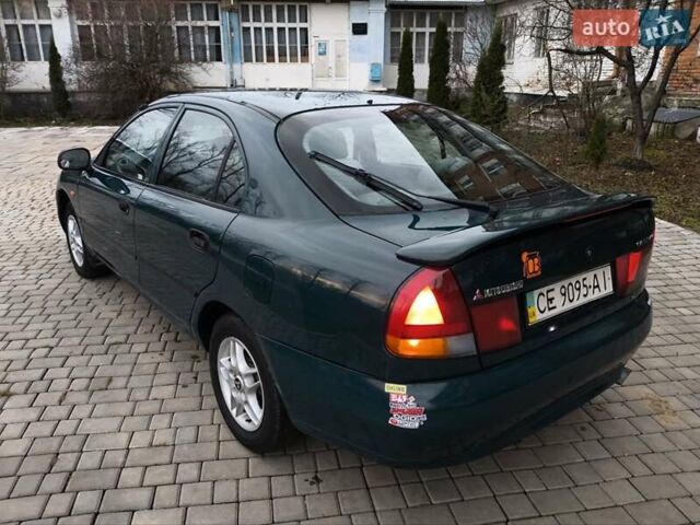 Зелений Міцубісі Харизма, об'ємом двигуна 1.6 л та пробігом 357 тис. км за 1480 $, фото 16 на Automoto.ua