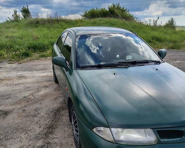 Зеленый Мицубиси Харизма, объемом двигателя 1.6 л и пробегом 399 тыс. км за 2300 $, фото 1 на Automoto.ua