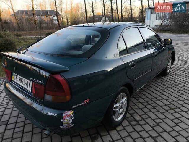 Зелений Міцубісі Харизма, об'ємом двигуна 1.6 л та пробігом 357 тис. км за 1499 $, фото 17 на Automoto.ua