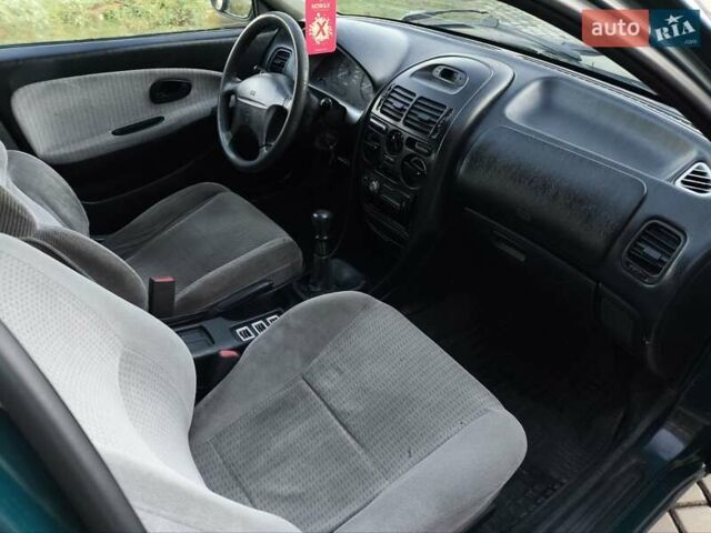 Зелений Міцубісі Харизма, об'ємом двигуна 1.6 л та пробігом 357 тис. км за 1499 $, фото 20 на Automoto.ua