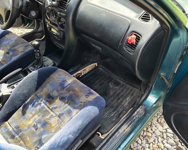 Зеленый Мицубиси Харизма, объемом двигателя 1.6 л и пробегом 399 тыс. км за 2300 $, фото 8 на Automoto.ua