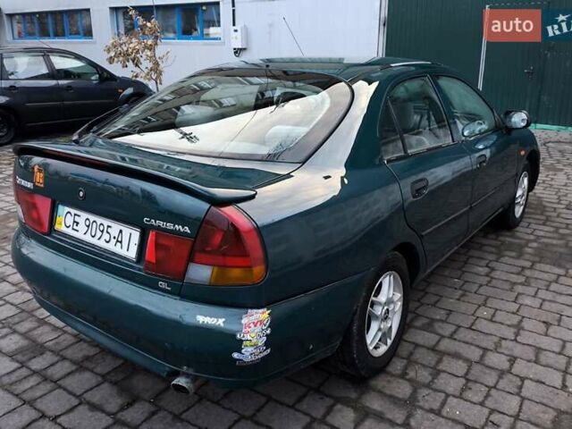 Зелений Міцубісі Харизма, об'ємом двигуна 1.6 л та пробігом 357 тис. км за 1399 $, фото 5 на Automoto.ua