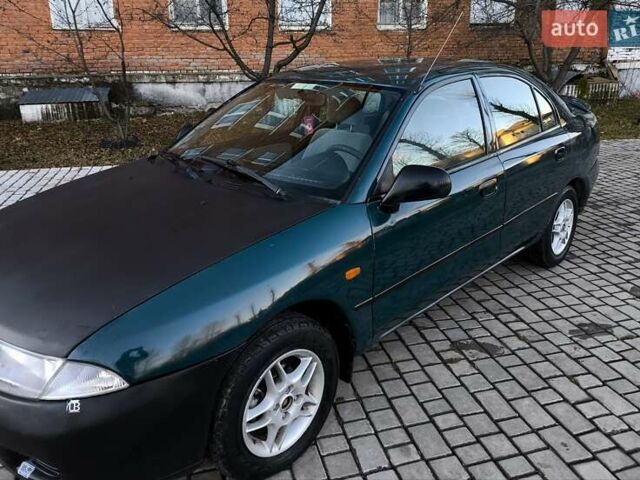 Зелений Міцубісі Харизма, об'ємом двигуна 1.6 л та пробігом 357 тис. км за 1499 $, фото 1 на Automoto.ua