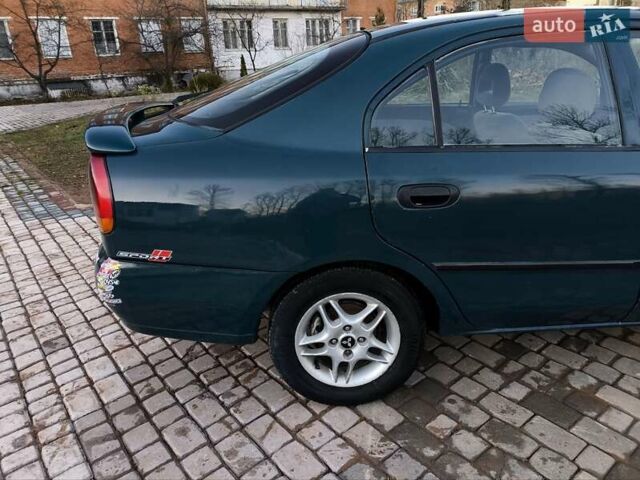 Зелений Міцубісі Харизма, об'ємом двигуна 1.6 л та пробігом 357 тис. км за 1499 $, фото 9 на Automoto.ua