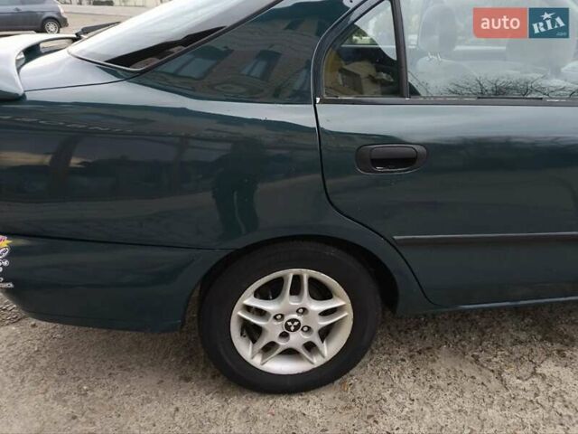 Зелений Міцубісі Харизма, об'ємом двигуна 1.6 л та пробігом 357 тис. км за 1480 $, фото 3 на Automoto.ua