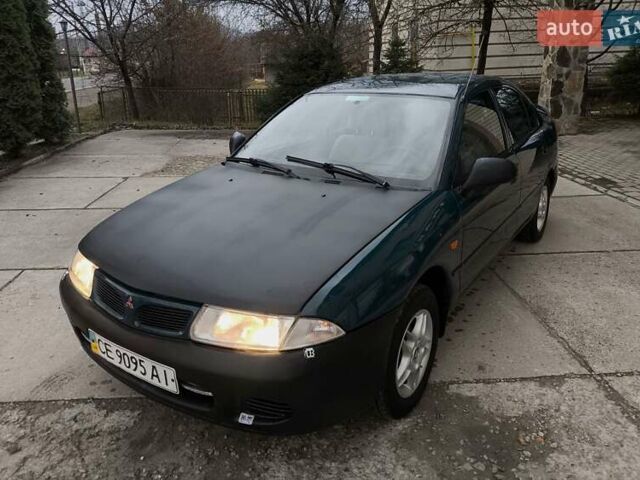 Зелений Міцубісі Харизма, об'ємом двигуна 1.6 л та пробігом 357 тис. км за 1480 $, фото 13 на Automoto.ua