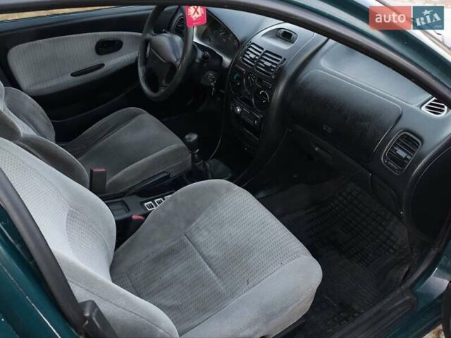 Зелений Міцубісі Харизма, об'ємом двигуна 1.6 л та пробігом 357 тис. км за 1499 $, фото 6 на Automoto.ua