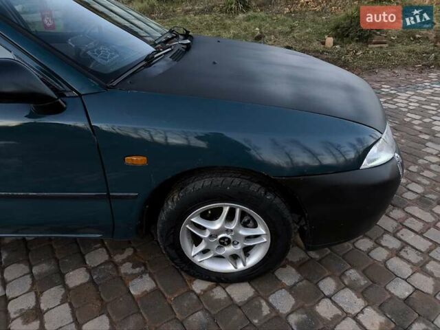 Зелений Міцубісі Харизма, об'ємом двигуна 1.6 л та пробігом 357 тис. км за 1499 $, фото 8 на Automoto.ua