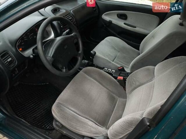 Зелений Міцубісі Харизма, об'ємом двигуна 1.6 л та пробігом 357 тис. км за 1399 $, фото 10 на Automoto.ua