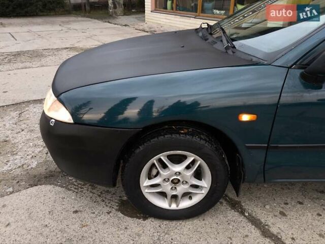 Зеленый Мицубиси Харизма, объемом двигателя 1.6 л и пробегом 357 тыс. км за 1480 $, фото 13 на Automoto.ua