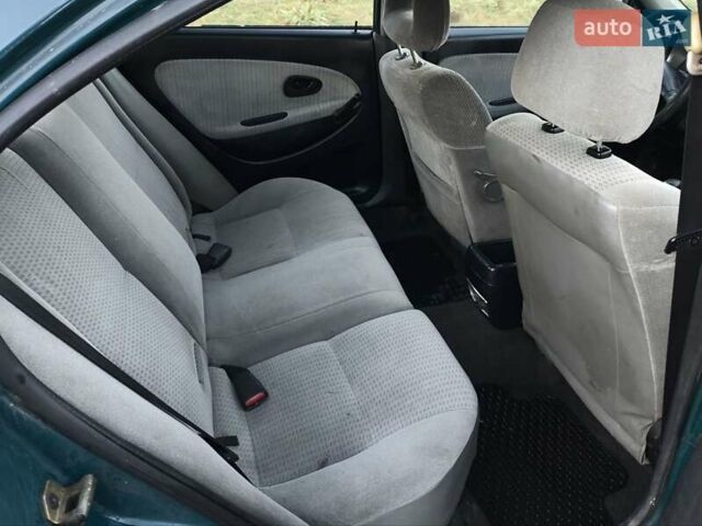 Зелений Міцубісі Харизма, об'ємом двигуна 1.6 л та пробігом 357 тис. км за 1499 $, фото 18 на Automoto.ua