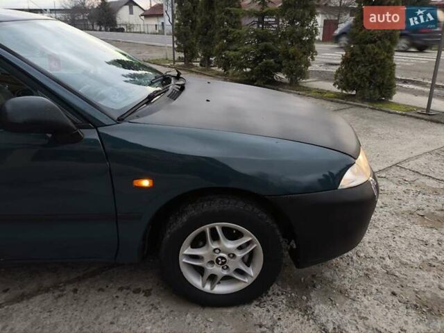 Зелений Міцубісі Харизма, об'ємом двигуна 1.6 л та пробігом 357 тис. км за 1480 $, фото 11 на Automoto.ua