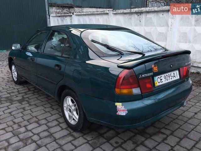 Зелений Міцубісі Харизма, об'ємом двигуна 1.6 л та пробігом 357 тис. км за 1399 $, фото 3 на Automoto.ua