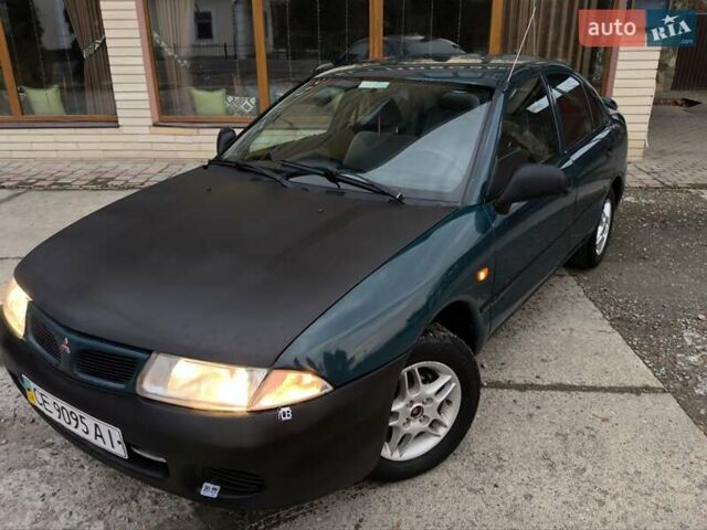 Зеленый Мицубиси Харизма, объемом двигателя 1.6 л и пробегом 357 тыс. км за 1480 $, фото 1 на Automoto.ua