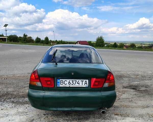 Зеленый Мицубиси Харизма, объемом двигателя 1.6 л и пробегом 399 тыс. км за 2300 $, фото 2 на Automoto.ua