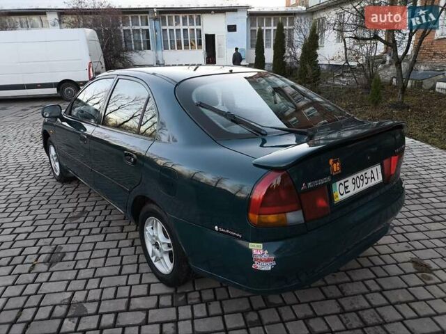 Зелений Міцубісі Харизма, об'ємом двигуна 1.6 л та пробігом 357 тис. км за 1499 $, фото 24 на Automoto.ua