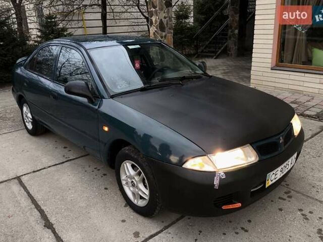 Зеленый Мицубиси Харизма, объемом двигателя 1.6 л и пробегом 357 тыс. км за 1480 $, фото 9 на Automoto.ua