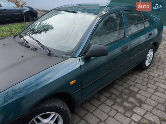 Зелений Міцубісі Харизма, об'ємом двигуна 1.6 л та пробігом 357 тис. км за 1399 $, фото 8 на Automoto.ua