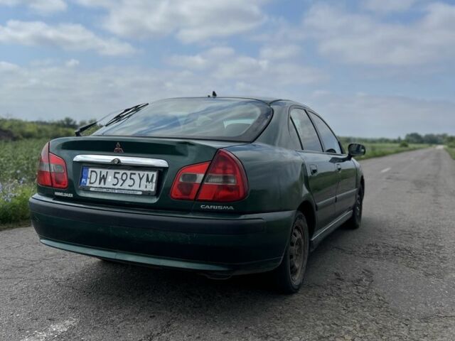 Зелений Міцубісі Харизма, об'ємом двигуна 1.9 л та пробігом 300 тис. км за 1429 $, фото 2 на Automoto.ua