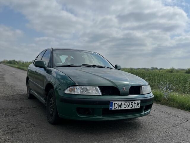Зелений Міцубісі Харизма, об'ємом двигуна 1.9 л та пробігом 300 тис. км за 1429 $, фото 1 на Automoto.ua
