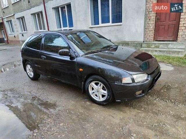 Чорний Міцубісі Кольт, об'ємом двигуна 1.3 л та пробігом 299 тис. км за 800 $, фото 21 на Automoto.ua