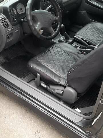 Чорний Міцубісі Кольт, об'ємом двигуна 1.3 л та пробігом 258 тис. км за 3650 $, фото 7 на Automoto.ua