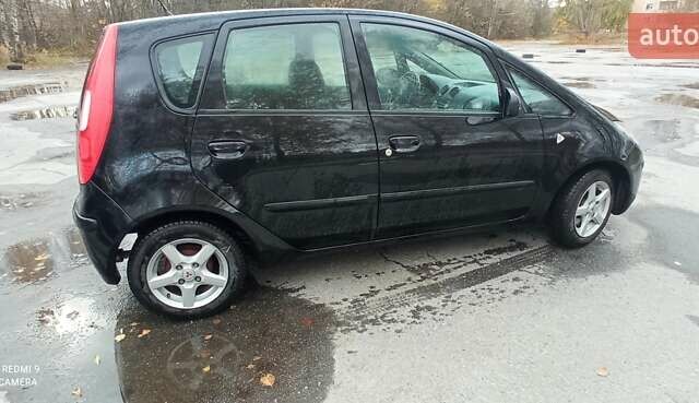Міцубісі Кольт 2005 у Житомирі на Automoto.ua Чорний Міцубісі Кольт, об'ємом двигуна 1.33 л та пробігом 156 тис. км за 3598 $, фото 2 на Automoto.ua