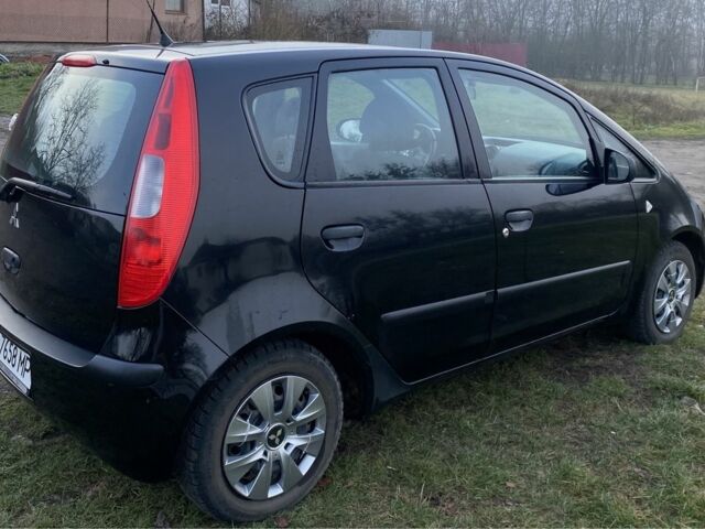 Чорний Міцубісі Кольт, об'ємом двигуна 1.1 л та пробігом 228 тис. км за 3150 $, фото 1 на Automoto.ua