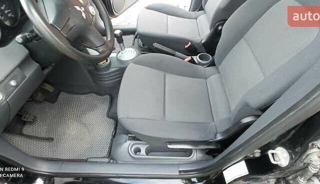 Міцубісі Кольт 2005 у Житомирі на Automoto.ua Чорний Міцубісі Кольт, об'ємом двигуна 1.33 л та пробігом 156 тис. км за 3598 $, фото 5 на Automoto.ua