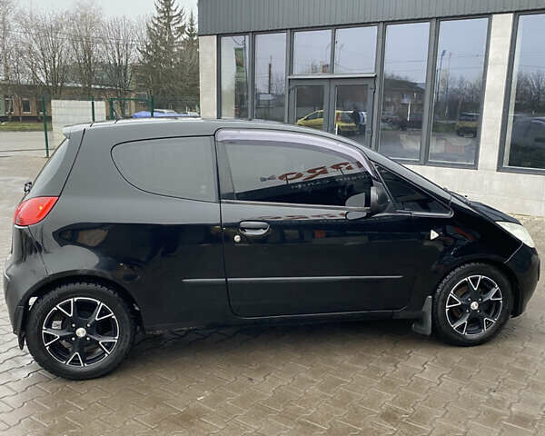 Черный Мицубиси Кольт, объемом двигателя 1.3 л и пробегом 114 тыс. км за 4000 $, фото 5 на Automoto.ua