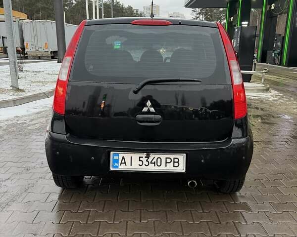 Черный Мицубиси Кольт, объемом двигателя 1.33 л и пробегом 266 тыс. км за 3300 $, фото 6 на Automoto.ua