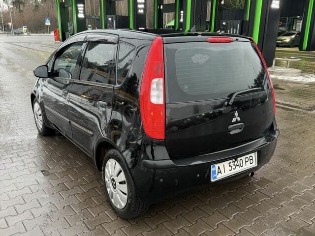 Чорний Міцубісі Кольт, об'ємом двигуна 1.3 л та пробігом 266 тис. км за 3150 $, фото 5 на Automoto.ua