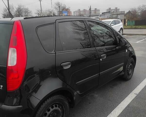 Черный Мицубиси Кольт, объемом двигателя 1.33 л и пробегом 184 тыс. км за 5000 $, фото 3 на Automoto.ua