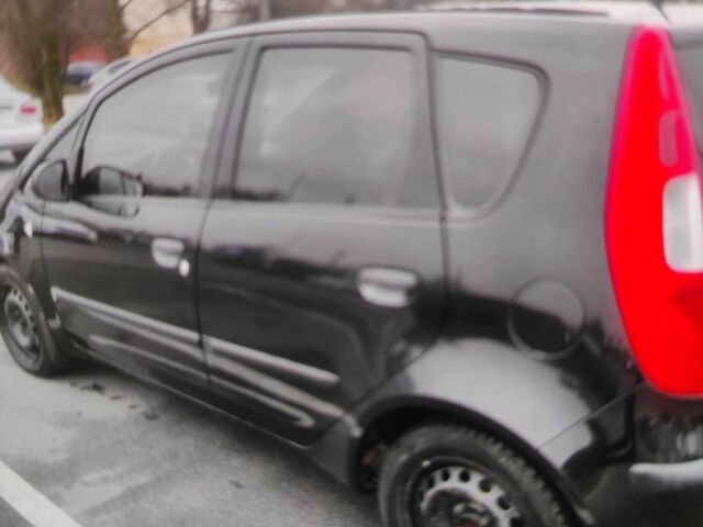 Чорний Міцубісі Кольт, об'ємом двигуна 1.3 л та пробігом 184 тис. км за 5000 $, фото 2 на Automoto.ua