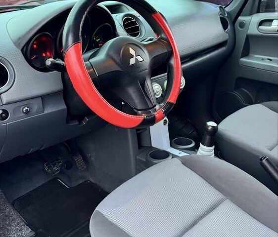 Черный Мицубиси Кольт, объемом двигателя 1.3 л и пробегом 154 тыс. км за 4700 $, фото 9 на Automoto.ua