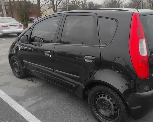 Черный Мицубиси Кольт, объемом двигателя 1.33 л и пробегом 184 тыс. км за 5000 $, фото 2 на Automoto.ua