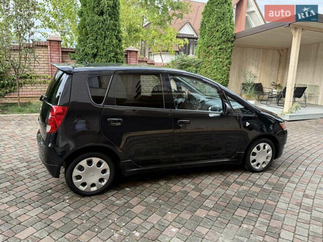 Черный Мицубиси Кольт, объемом двигателя 1.3 л и пробегом 173 тыс. км за 5800 $, фото 5 на Automoto.ua