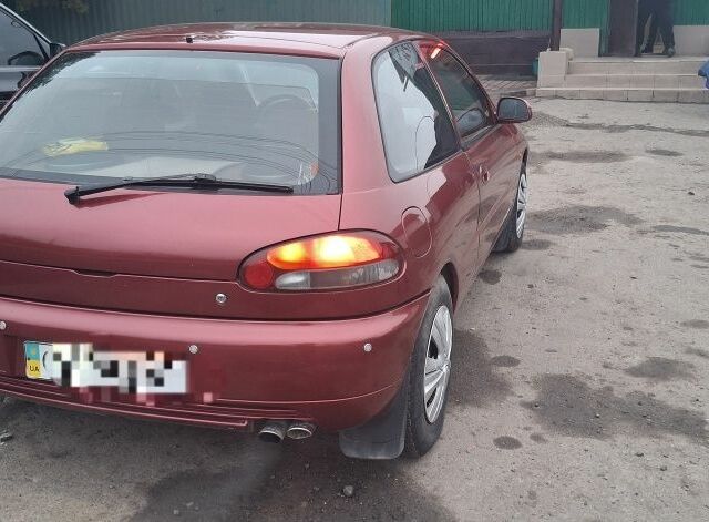 Червоний Міцубісі Кольт, об'ємом двигуна 1.3 л та пробігом 280 тис. км за 900 $, фото 10 на Automoto.ua