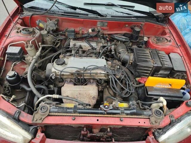 Красный Мицубиси Кольт, объемом двигателя 1.3 л и пробегом 200 тыс. км за 1300 $, фото 1 на Automoto.ua