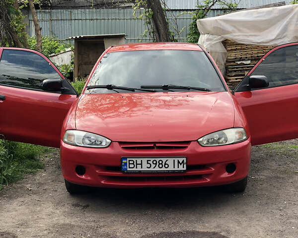 Красный Мицубиси Кольт, объемом двигателя 1.3 л и пробегом 230 тыс. км за 2350 $, фото 4 на Automoto.ua