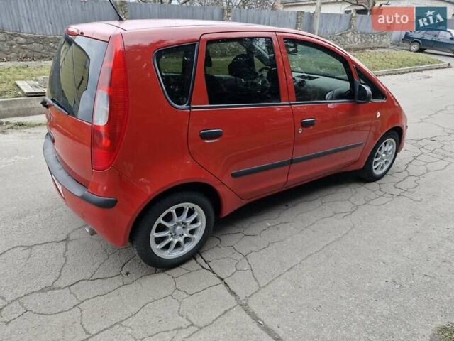 Красный Мицубиси Кольт, объемом двигателя 1.33 л и пробегом 241 тыс. км за 2850 $, фото 3 на Automoto.ua