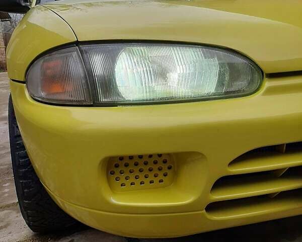 Желтый Мицубиси Кольт, объемом двигателя 1.3 л и пробегом 80 тыс. км за 1600 $, фото 4 на Automoto.ua